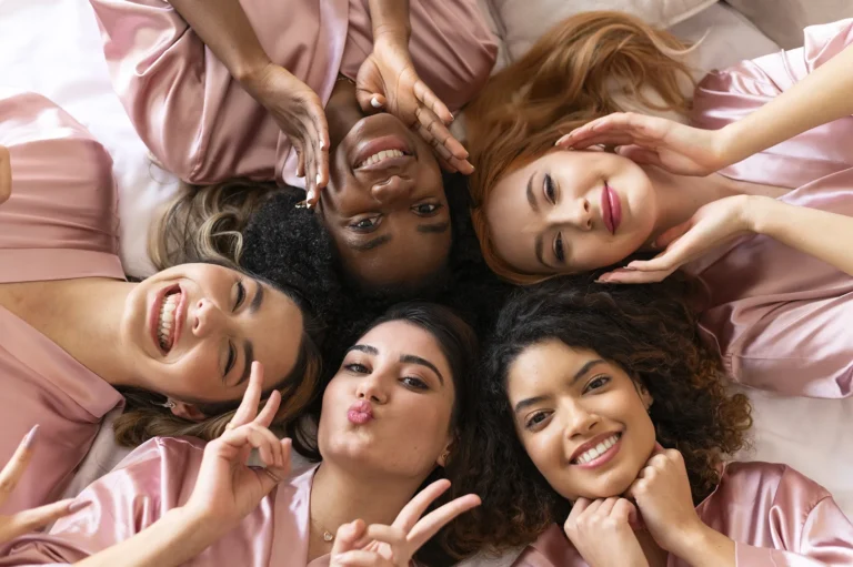 close up women laying bed together